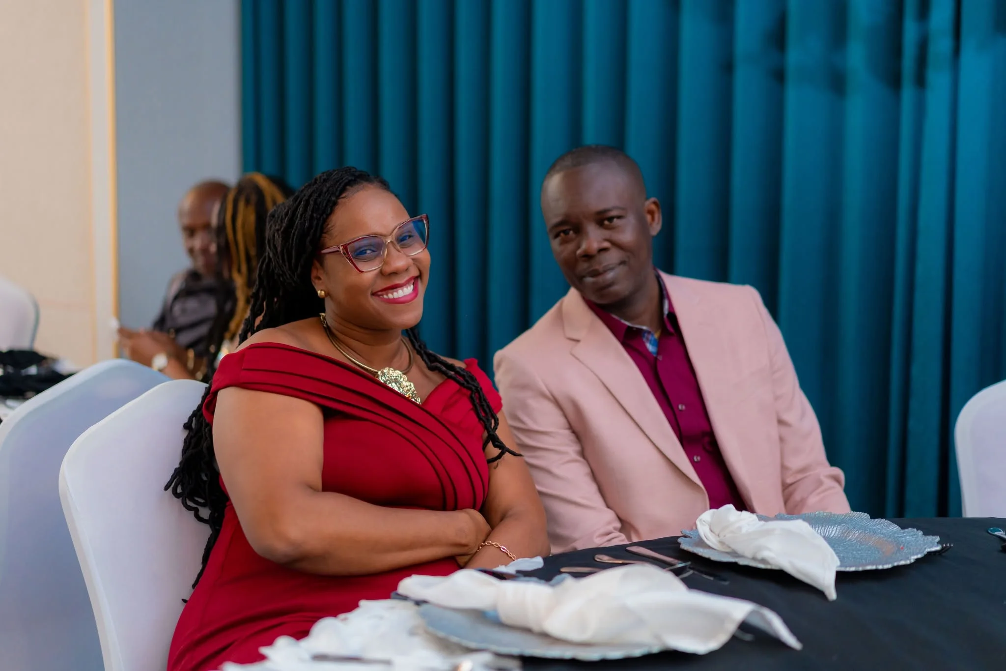 Two attendees seated at Morgan’s Learning Centre’s staff social